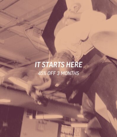 A person bouldering indoors on a climbing wall, with the text IT STARTS HERE 45% OFF 3 MONTHS overlaid on the image. The photo has a sepia tone.