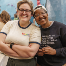 Two people smiling at Boston Bouldering Project
