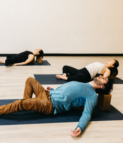 A class does heart openers during a Yin yoga class