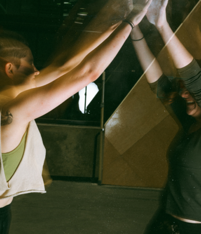 Two people high fiving after a climbing class in DC