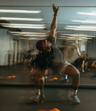Bouldering Project instructor guiding a fitness class in DC