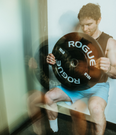 Member does functional fitness exercises during circuit class