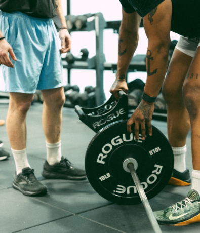 A client getting personal training with an instructor at Bouldering Project