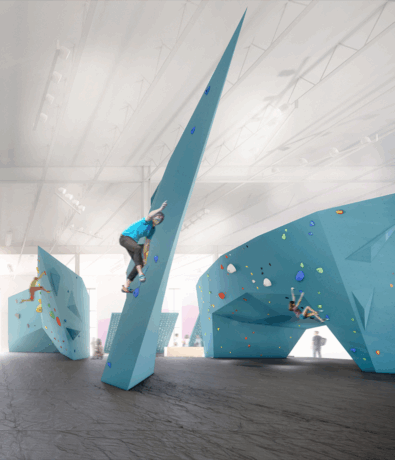 A modern Minneapolis Indoor Climbing Gym, Bouldering Project features climbers scaling uniquely shaped blue walls with colorful holds, all under bright, natural lighting.
