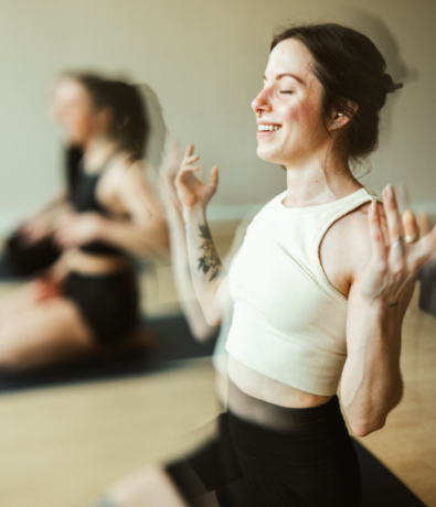 Woman in restorative yoga class at Bouldering Project Brooklyn
