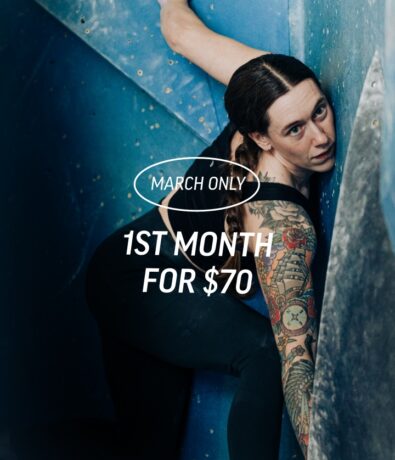 A woman with tattoos climbs an indoor rock wall at Upper Walls, Fremont. Overlaid text reads: March Only. 1st month for $70.