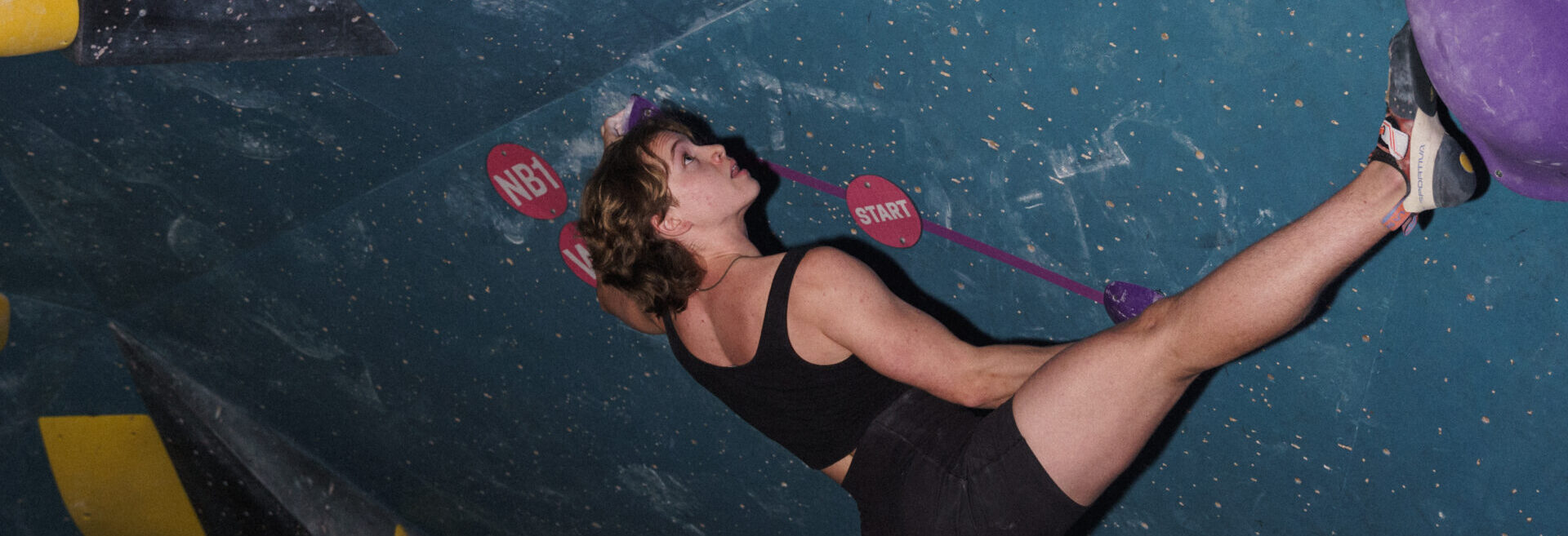 An Affinity Group climber climbs in the cave at DC Bouldering Project.