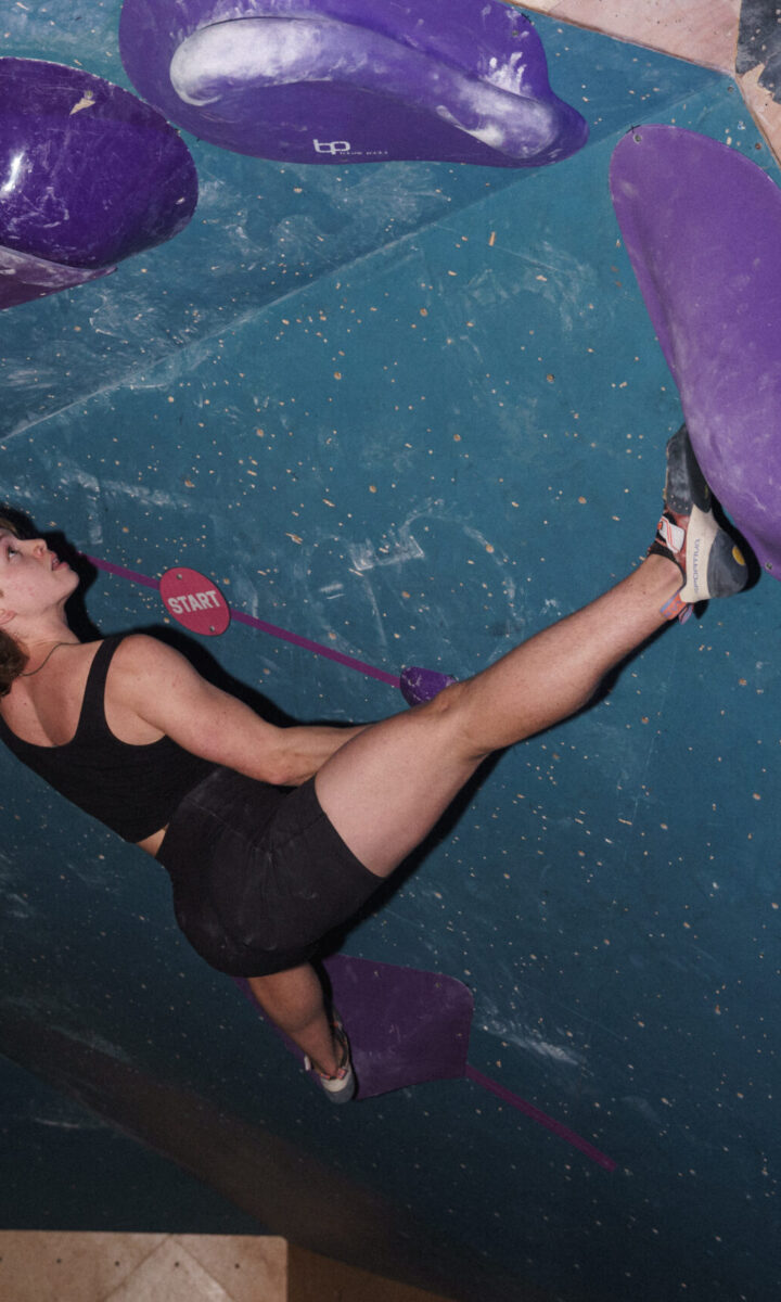 An Affinity Group member climbs in the cave at DC Bouldering Project.