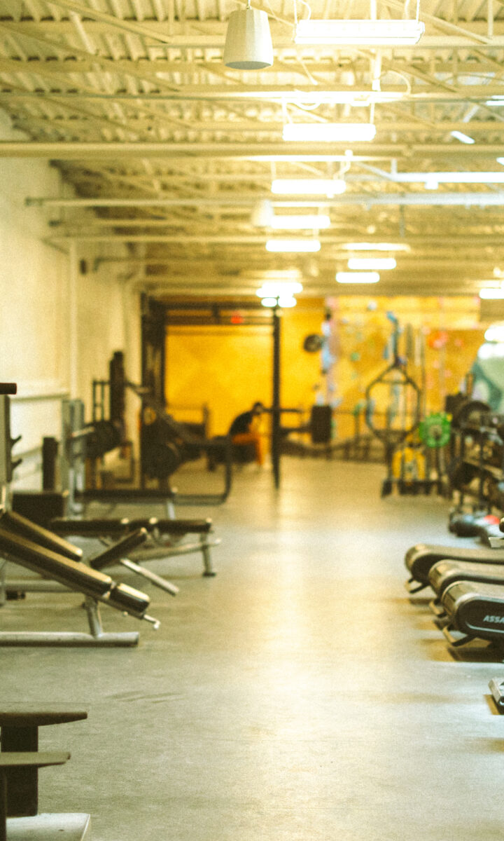 Cardio and weightlifting equipment at Boston Bouldering Project