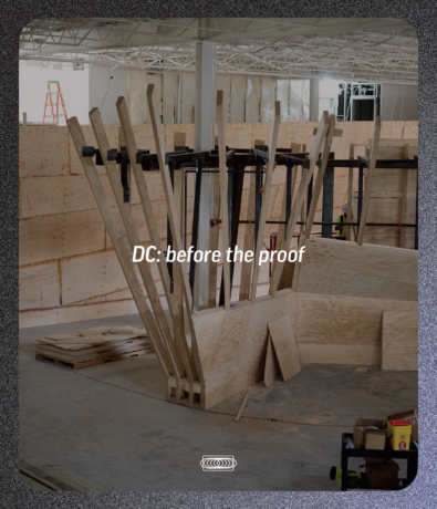 An unfinished wooden structure inside a construction site, overlaid with the text DC: before the proof, serving as the foundation for a marketing strategy.